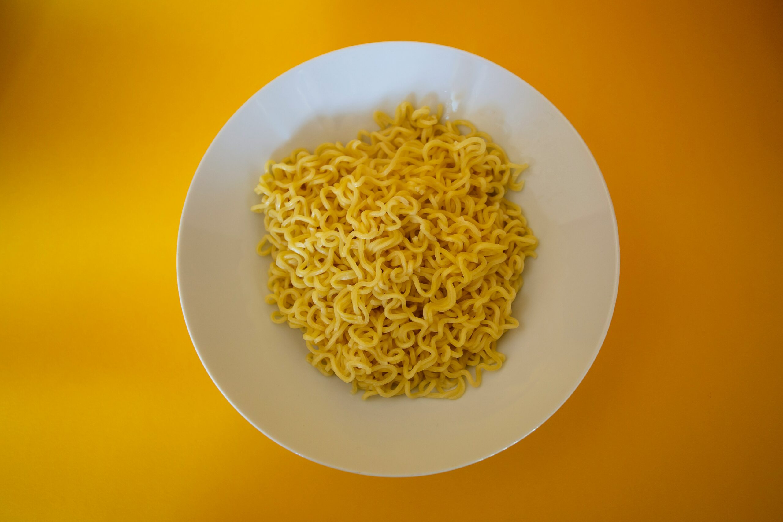 noodles dish on a yellow background